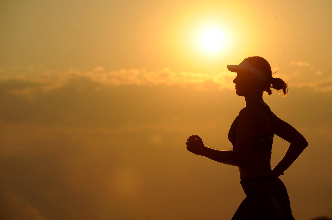 woman health running in sunset
